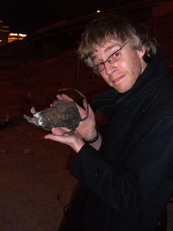 Tom happy with the rat burning and clubbing.