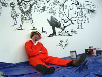 Tom wears himself out painting a mural in Meltdown Comics, Hollywood