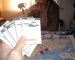 Inspecting the new illustrated cards - Andy T takes it very seriously early on.