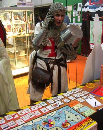 "Hello!? No.... I'm in a games fair ... GAMES FAIR! .... No, sorry I can't ... I'm a knight... A KNIGHT.... Hang on, I'll take my helmet off"  - And that's when he was beheaded by an enemy broadsword. Remember, mobile phones and crusades just don't mix.