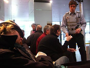 A museum guard catches a tramp asleep in his gallery.