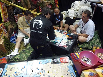 Andy S starts up a demo in the booth. Check out the camo pet beds we used as cushions. 