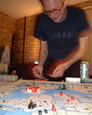 Andy T pretending to be a giant, squashing the tiny civilians of his world.